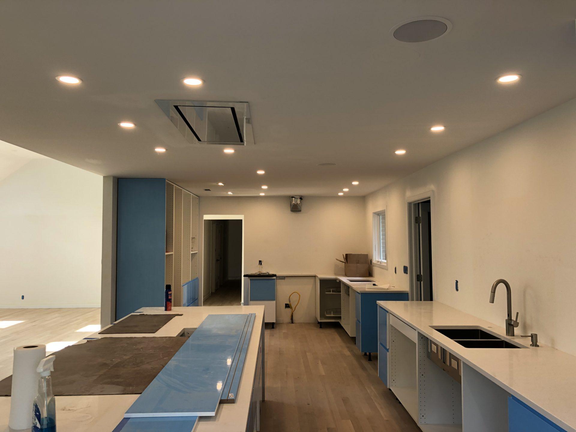 Minimalist kitchen with recessed lighting