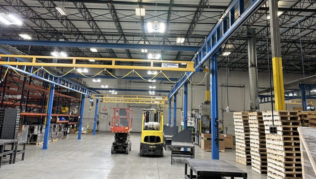 Newly installed LED high bay lights over a bridge crane