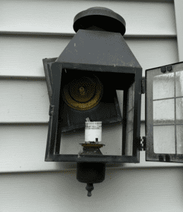 Broken residential light fixture prior to replacement by King Electric